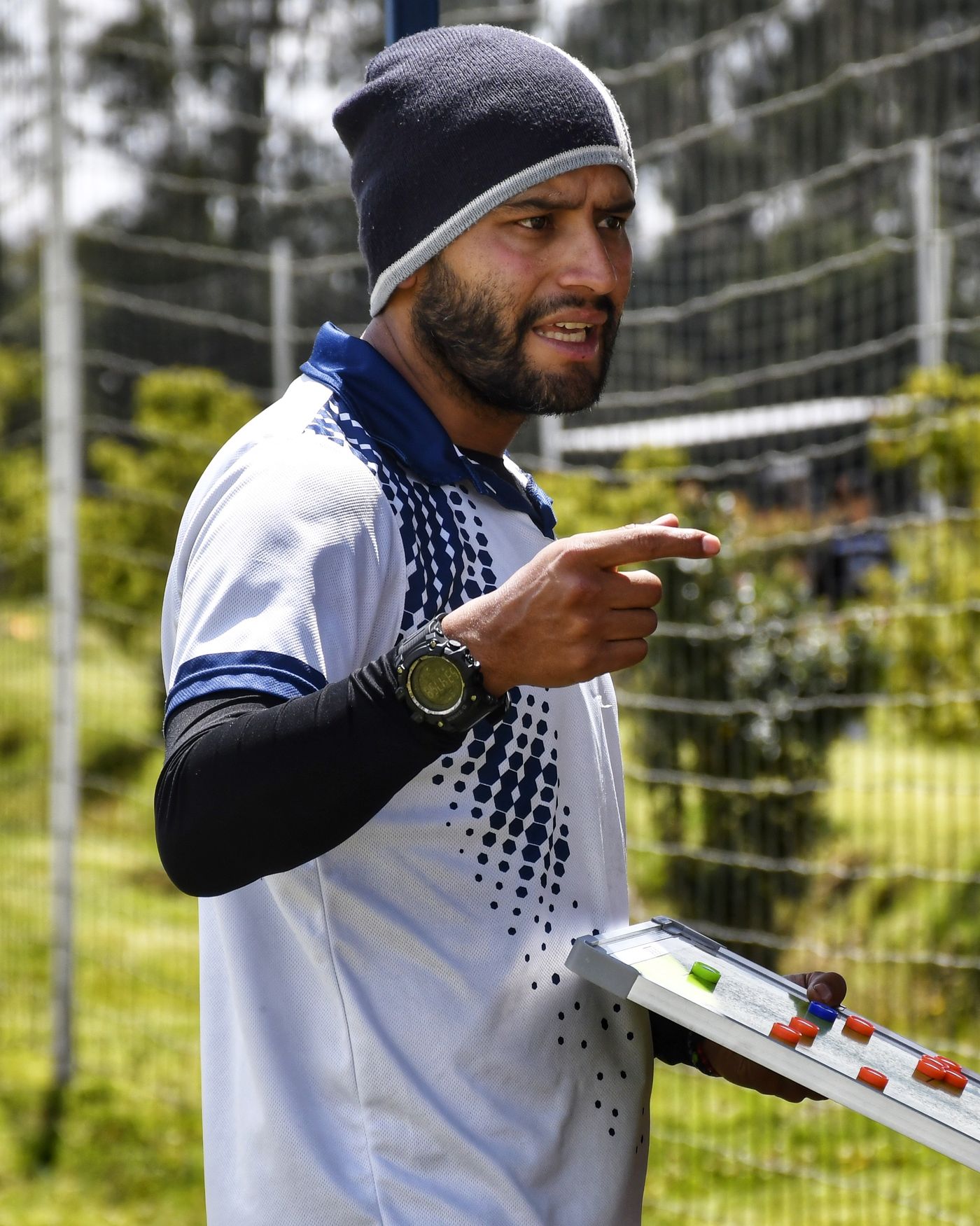 Coach explaining strategy on a tactical board